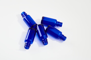 Blue glass jars without logos for mockups of medicines, vitamins, cosmetics