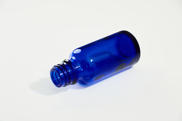 Blue glass jar without logos for mockups of medicines, vitamins, cosmetics