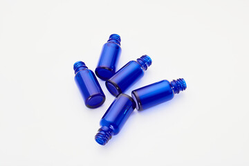 Blue glass jars without logos for mockups of medicines, vitamins, cosmetics