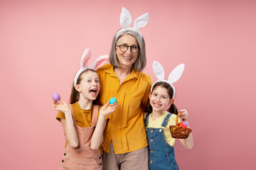 Grandmother and Granddaughters Wearing Bunny Ears Celebrating Easter
