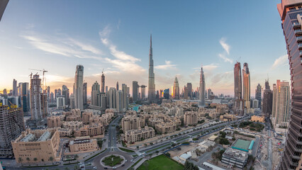 Fototapeta premium Dubai Downtown skyline day to night timelapse with Burj Khalifa and other towers panoramic view from the top in Dubai