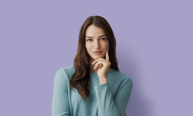 Attractive woman posing with hand on chin