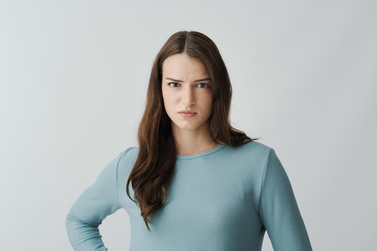 Upset disgusted woman staring at camera