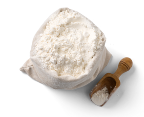 Bag with flour and wooden scoop isolated. Top view of flour in bag with spoon.