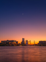 Naklejka premium Rotterdam, The Netherlands. View at the city center. Evening view. Cityscape in the evening. Skyscrapers and buildings. Postcard, background, wallpaper.