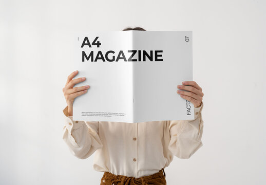 Mockup Of Woman Holding Customizable A4 Magazine, Covering Face