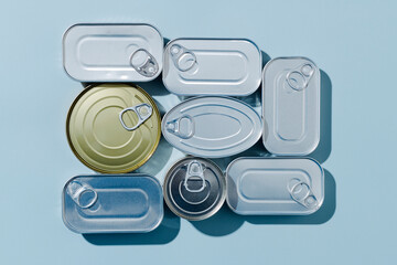 some unopened tin cans of different canned food