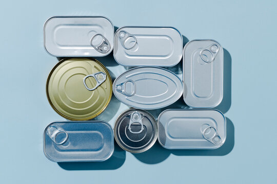 some unopened tin cans of different canned food