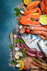 Set of fish, seafood and shellfish. Vertical photo. Top view.