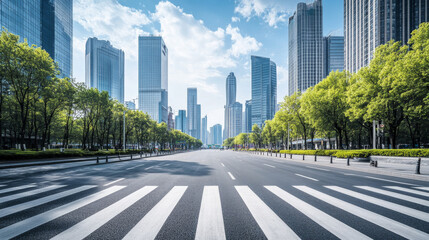A wide city road with a zebra crossing, surrounded by soaring skyscrapers in a modern metropolis