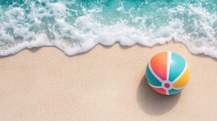 Obraz premium High Angle View of Colorful Beach Ball on Sandy Shoreline