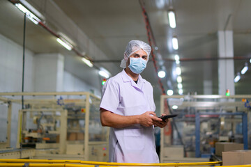 Employee working with packaging machine.