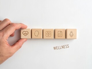 Employee engagement drives culture and strategy alignment concept. Wellness icons on wooden blocks with a hand, symbolizing health and mindfulness.