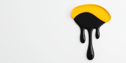 A black and yellow blob with a yellow line on it is dripping. The blob is in the shape of a curve and is located on a white background