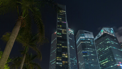 Looking up perspective of modern business skyscrapers glass and sky view landscape of commercial...