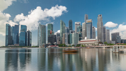 Obraz premium Business Financial Downtown City and Skyscrapers Tower Building at Marina Bay timelapse hyperlapse, Singapore,