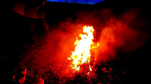 A guy makes fire outside ash danger