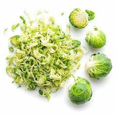 Freshly shredded Brussels sprouts with whole sprouts scattered, perfect for healthy recipes and meal preparation.