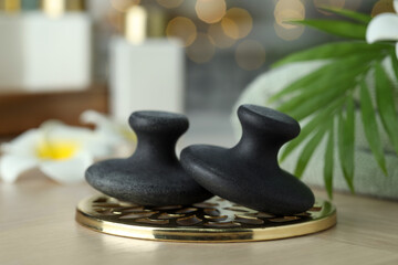 Massage stones on table, closeup. Spa treatment