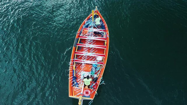 People prepare the boat to celebrate the day of Iemanja, or the day of Our Lady of Navigators. Group of people gather on the beach in Brazil and celebrate. Iemanja is a popular Afro-Brazilian deity