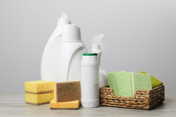 Eco-friendly cleaning products and supplies on wooden table