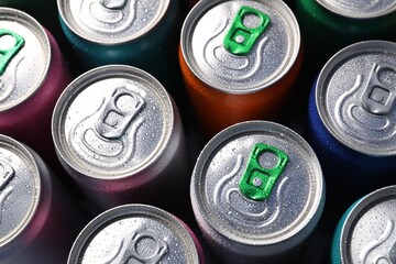 Many aluminium cans of beverage as background, above view