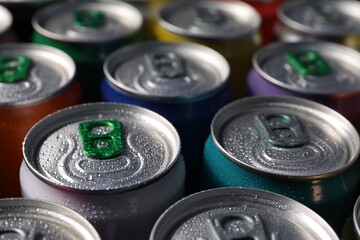 Many aluminium cans of beverage as background, closeup