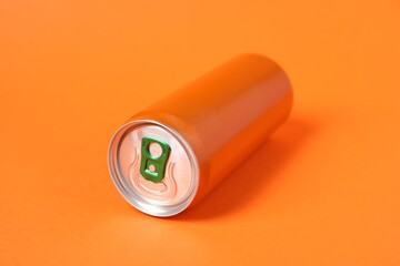 One tin can on orange background, closeup