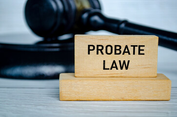 Probate Law text on wooden block with blurred lawyer gavel background. Probate law concept