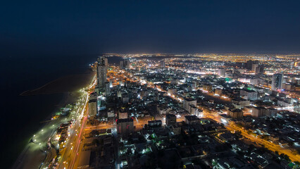 Naklejka premium Cityscape of Ajman from rooftop day to night aerial timelapse