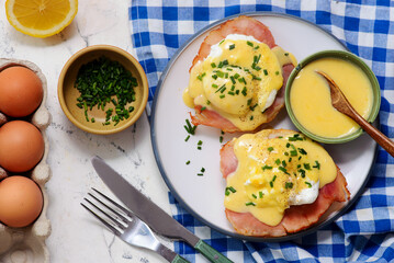 Eggs Benedict with Ham on a Plate for Breakfast.  .Healthy appetizer.