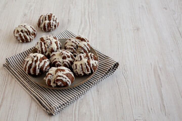 Homemade Profiteroles with Coconut Cream on a Plate, side view. Copy space.