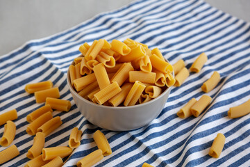 Homemade Raw Heart-Shaped Rigacuore Pasta in a Bowl, side view.
