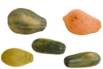 Assorted papaya fruits, various stages of ripeness, isolated on black background