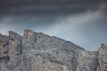 Majestic rocky peaks of the Dolomites near Seceda showcasing dramatic overcast skies and rugged natural beauty