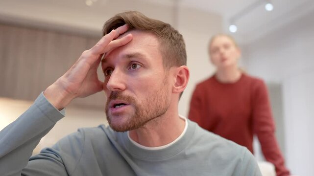 Enraged furious woman shouts pushing stressed man to breaking point, fed up man holds head overwhelmed. Male exhausted from endless arguments nagging, emotional burnout, toxic relationship, the end