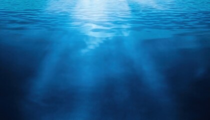 Obraz premium soft ripples of deep blue water with sunlight reflection creating a dreamy abstract pattern, perfect for background and design