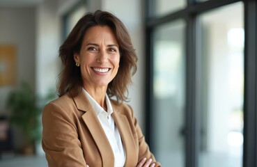 Obraz premium Successful mature hispanic businesswoman in office. Smiling 40s lady stands confidently in formal wear. Business woman leader, entrepreneur with positive attitude, modern corporate executive happy