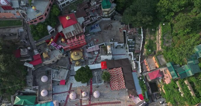 Aerial wide view of Jawalamukhi Jwala Ji Temple complex with golden dome at sunset in Kangra, Himachal Pradesh, sacred Hindu Shakti Peeth pilgrimage site in India