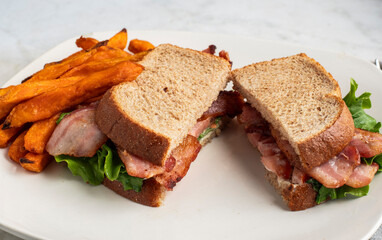 blt sandwich  served with sweet potato fries