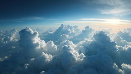 Aerial view of thick cumulonimbus clouds illuminated sunlight. Fluffy cloudscape panorama, climate change background. Beauty of blue sky, ozone layer, global warming themes. Perfect peaceful serene