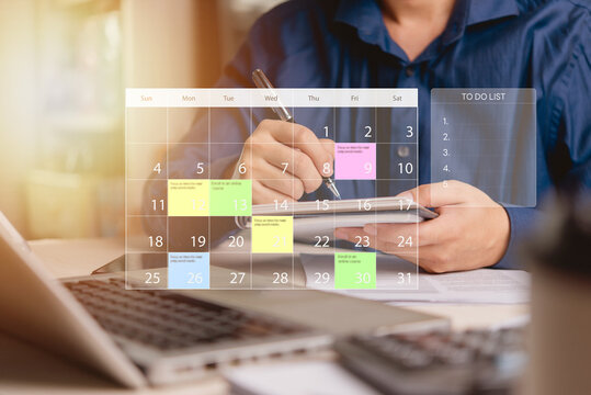 businessman planning his tasks using a calendar and to-do list on a smartphone. Efficient time management, work planning, and productivity concept.