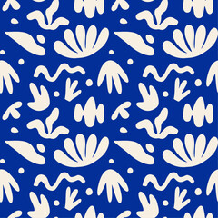 Abstract cutouts shapes seamless pattern design with vector illustration elements of different types exotic leaves and flowers, folk plants, geometric silhouette in boho aesthetic