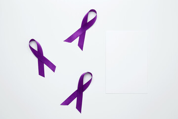 Purple Epilepsy Awareness Day, purple ribbon held, symbol of support. Mock up white paper