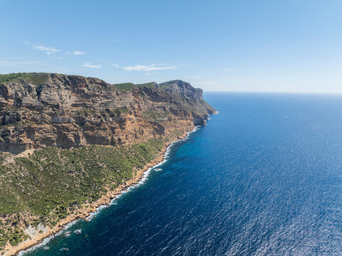 Landscape of high cliffs and blue ocean water. Cassis, France