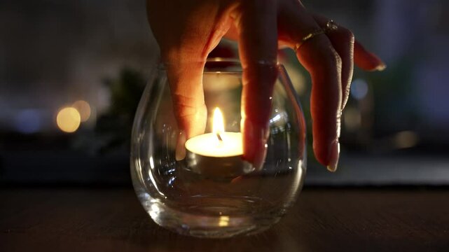 Positioning a candle inside a glass_4K