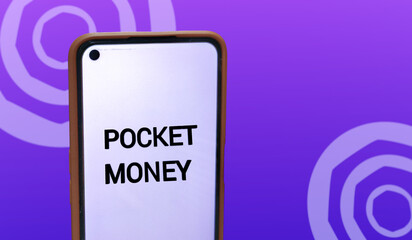 A smartphone screen displays 'Pocket Money' against a rich purple backdrop, blending the concept of personal finance with a sleek, modern aesthetic.