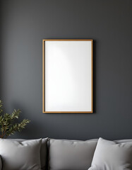 A modern picture frame positioned on a dark silver wall in a living room with a sofa