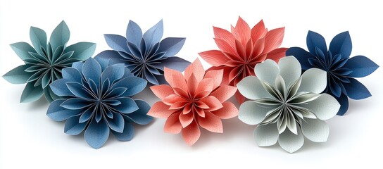 Colorful paper flowers arranged in a row on white background.