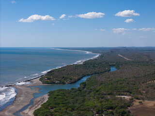 Coastal view with river and lush greenery in Nicaragua on sunny day